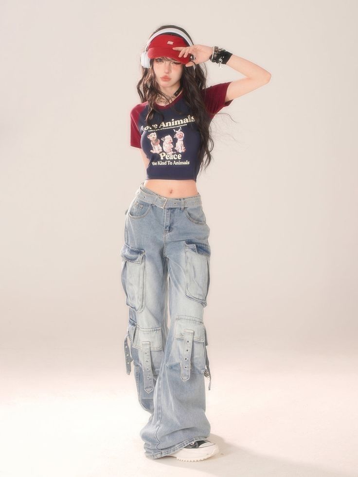 woman wearing black cropped tee and light blue cargos